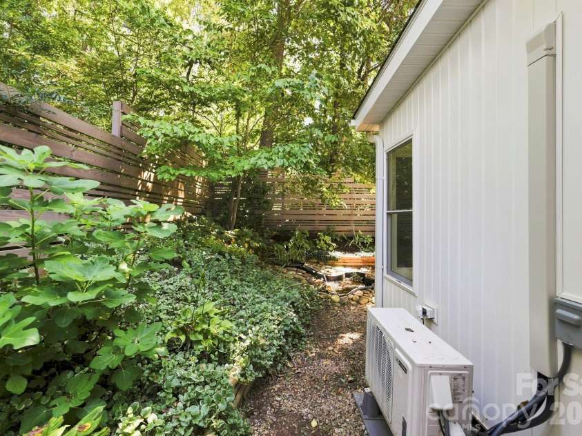 8A Bent Grass Court, Black Mountain, NC 28711.  MLS# CAR4422904, YatesRealty ID 50072. Back Yard with mature landscaping and beautiful fig tree