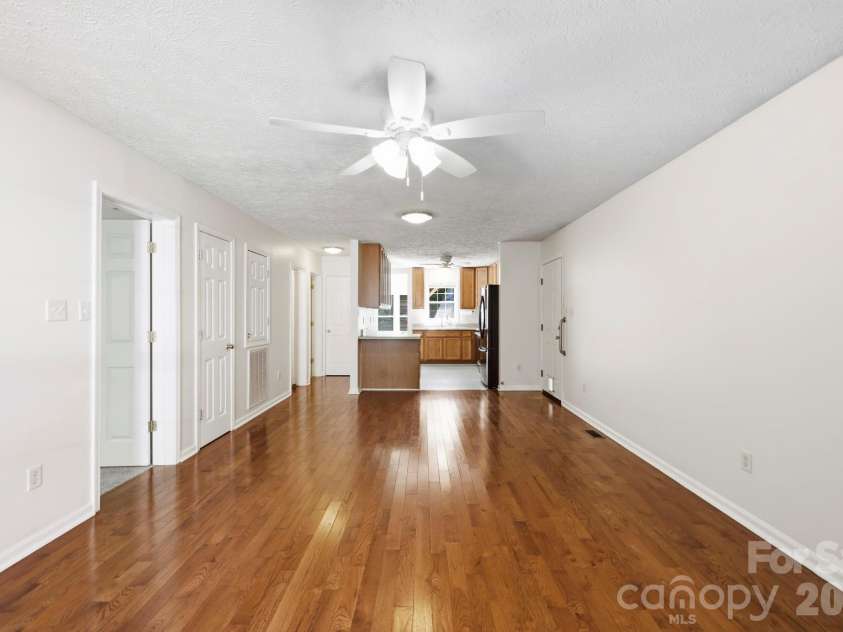 8A Bent Grass Court, Black Mountain, NC 28711.  MLS# CAR4422904, YatesRealty ID 50072. Open Living Room/ Dining/ Kitchen Area