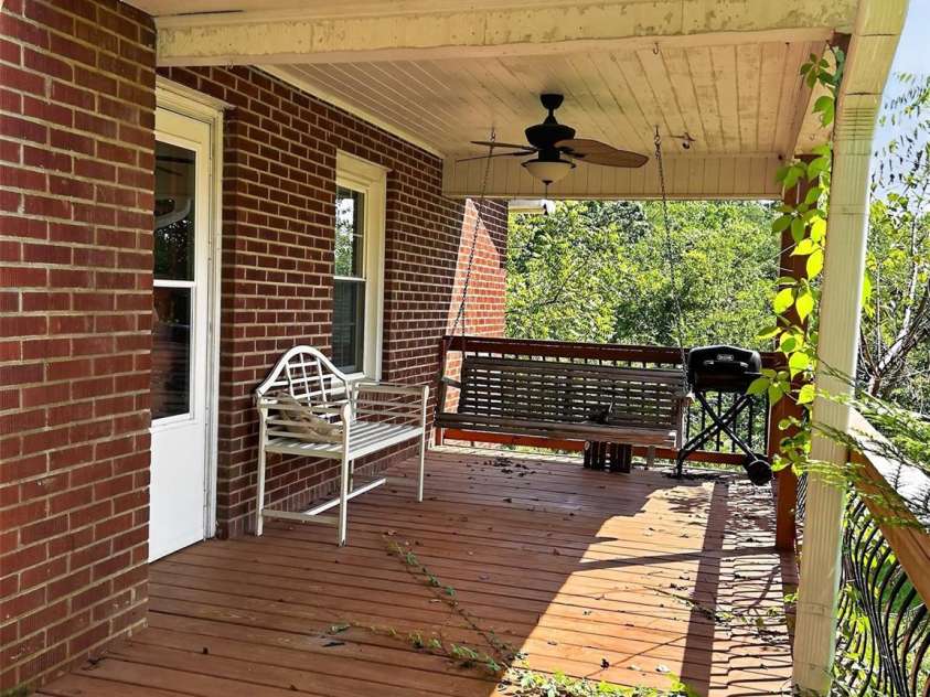 683 McDaniel Road, Lake Lure, NC 28746.  MLS# CAR4422885, YatesRealty ID 50074. Covered Side Deck