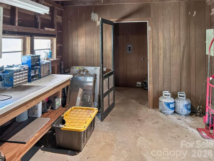683 McDaniel Road, Lake Lure, NC 28746.  MLS# CAR4422885, YatesRealty ID 50074. Enclosed Garage/Workshop