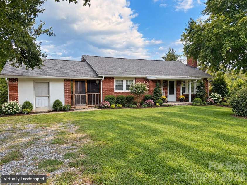 683 McDaniel Road, Lake Lure, NC 28746.  MLS# CAR4422885, YatesRealty ID 50074. Front of Home - Virtually Landscaped