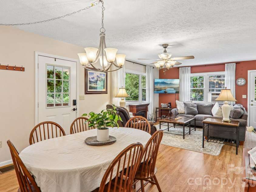 169 Highview Drive, Maggie Valley, NC 28751.  MLS# CAR4411083, YatesRealty ID 50102. Dining table looking towards living room