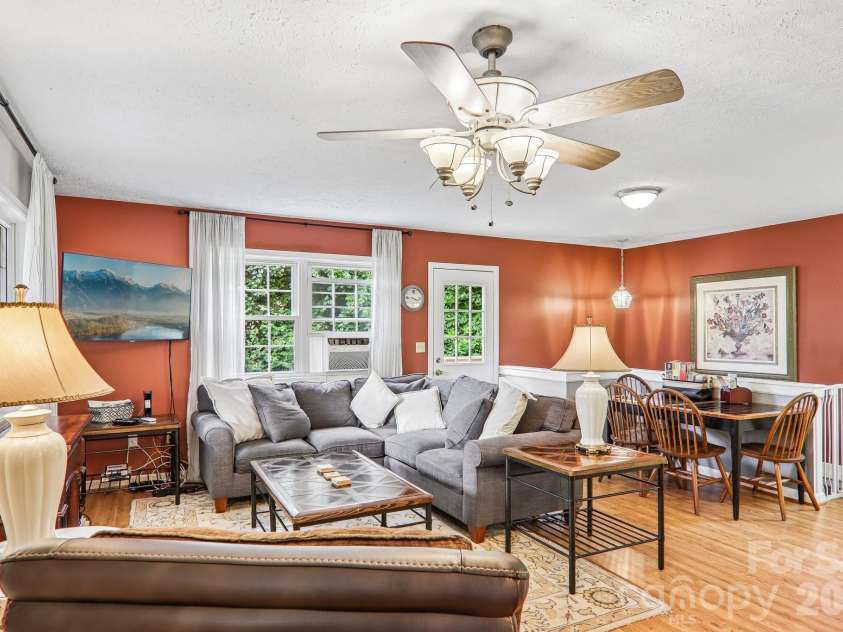 169 Highview Drive, Maggie Valley, NC 28751.  MLS# CAR4411083, YatesRealty ID 50102. Living area with stairs to lower level