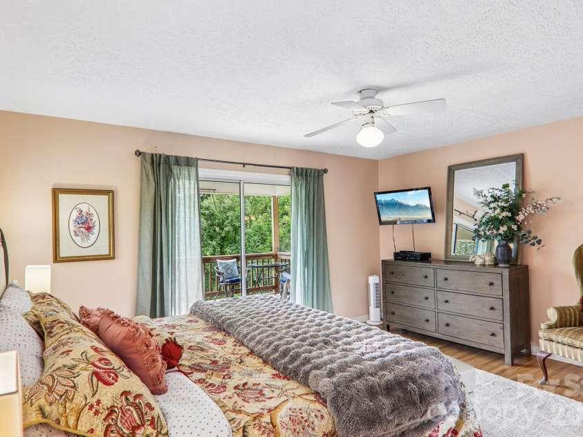169 Highview Drive, Maggie Valley, NC 28751.  MLS# CAR4411083, YatesRealty ID 50102. Primary bedroom, sliders open on to deck