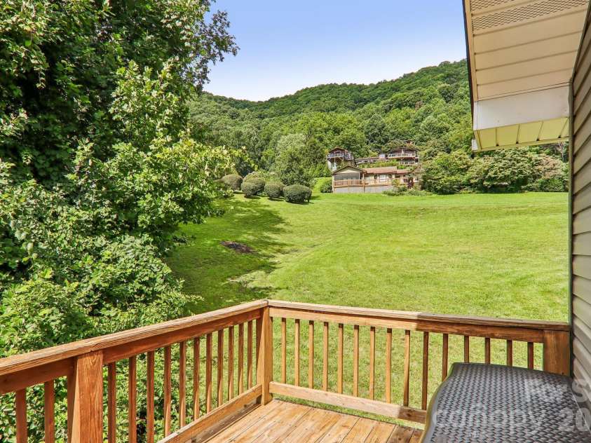 169 Highview Drive, Maggie Valley, NC 28751.  MLS# CAR4411083, YatesRealty ID 50102. Surrounded by mountains