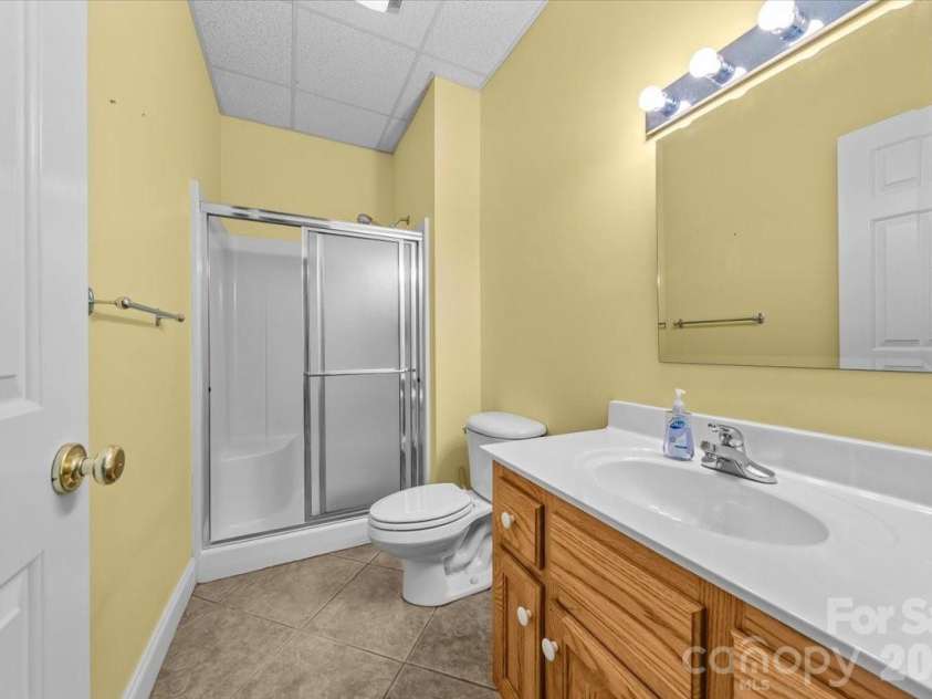 704 Shoreline Drive, New London, NC 28127.  MLS# CAR4361160, YatesRealty ID 50128. Lower level bathroom