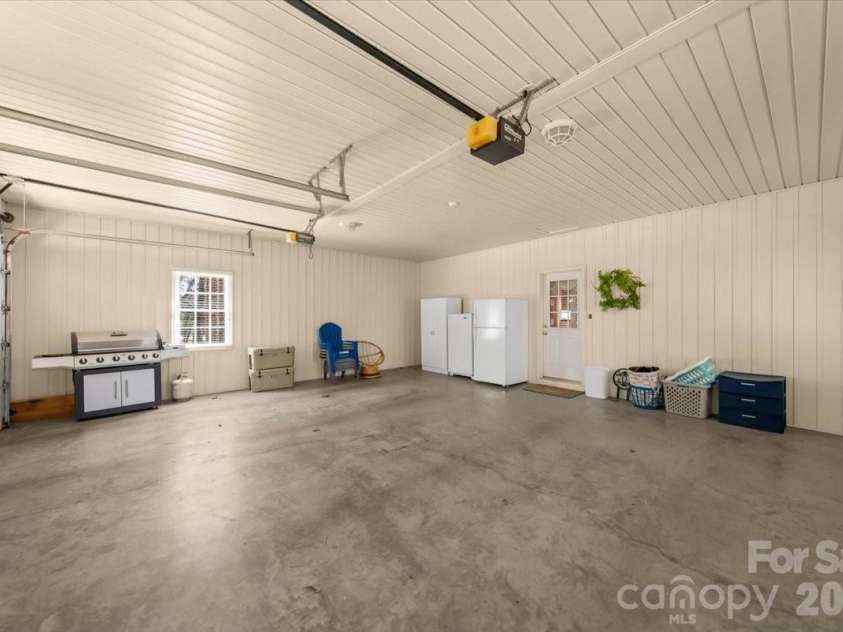 704 Shoreline Drive, New London, NC 28127.  MLS# CAR4361160, YatesRealty ID 50128. Main level Double Garage