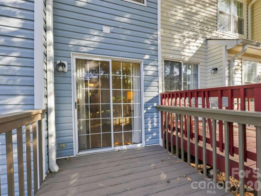 8112 Circle Tree Lane, Charlotte, NC 28277.  MLS# CAR4423668, YatesRealty ID 50143. Back deck off the living room.