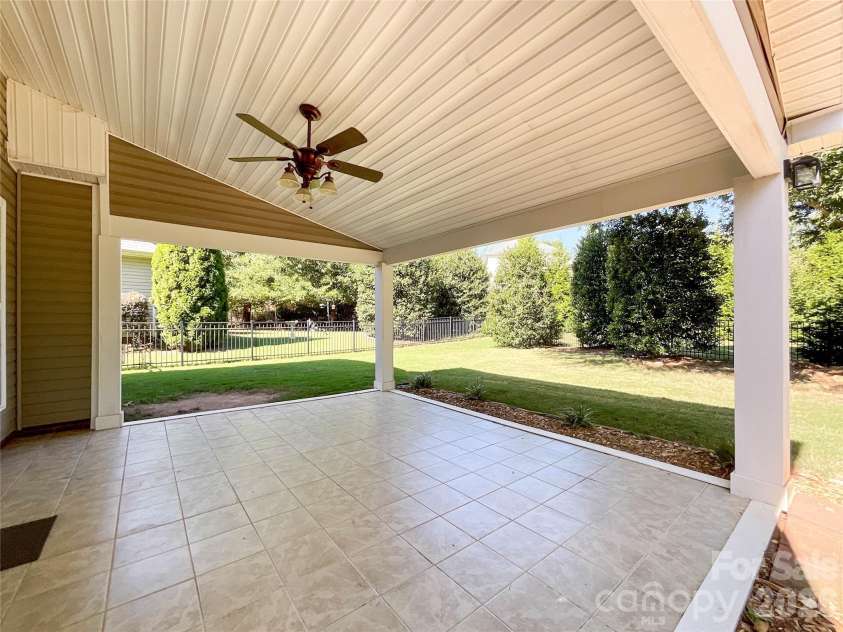 1112 Tranquil Falls Lane, Matthews, NC 28104.  MLS# CAR4422418, YatesRealty ID 50155. Covered Porch