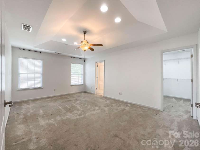 1112 Tranquil Falls Lane, Matthews, NC 28104.  MLS# CAR4422418, YatesRealty ID 50155. Primary Bedroom