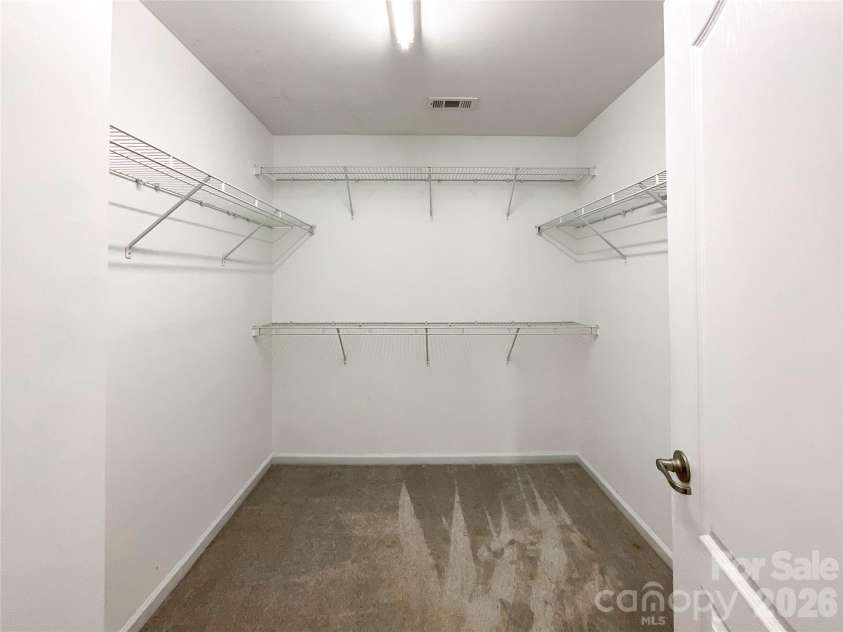 1112 Tranquil Falls Lane, Matthews, NC 28104.  MLS# CAR4422418, YatesRealty ID 50155. Primary Closet