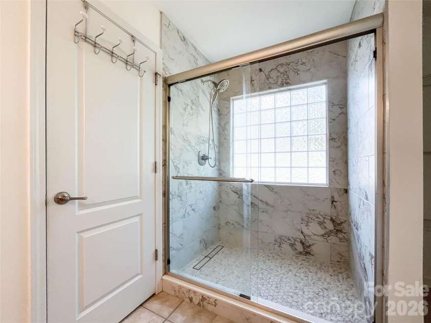 1112 Tranquil Falls Lane, Matthews, NC 28104.  MLS# CAR4422418, YatesRealty ID 50155. Updated Primary Bathroom