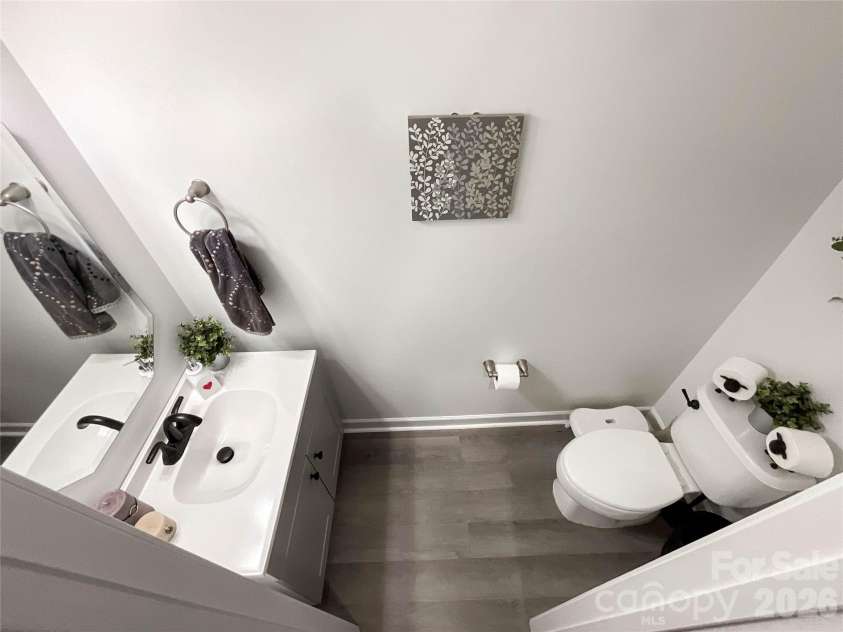 6019 Grassy Knoll Circle, Matthews, NC 28104.  MLS# CAR4422466, YatesRealty ID 50157. Half bathroom