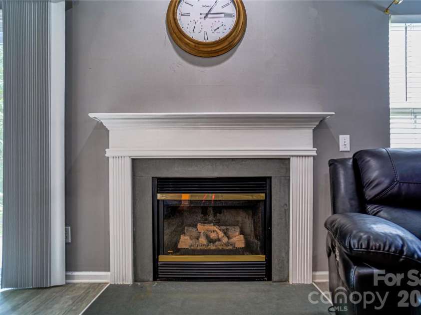 9612 Veronica Drive, Charlotte, NC 28215.  MLS# CAR4422577, YatesRealty ID 50159. Living Room Fireplace
