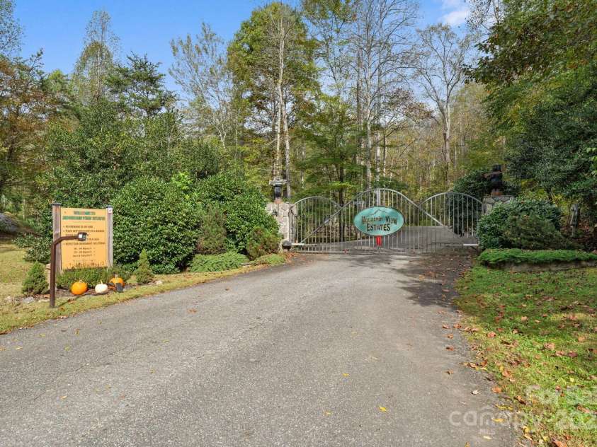 80 Slow Lane, Whittier, NC 28789.  MLS# CAR4307656, YatesRealty ID 5016. Entrance gate