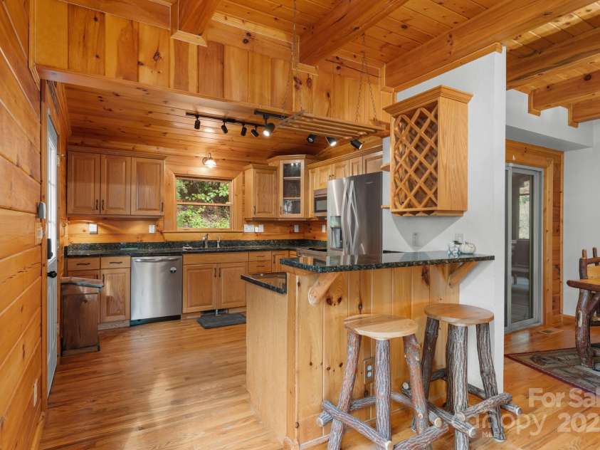 80 Slow Lane, Whittier, NC 28789.  MLS# CAR4307656, YatesRealty ID 5016. Kitchen (angle from living room)