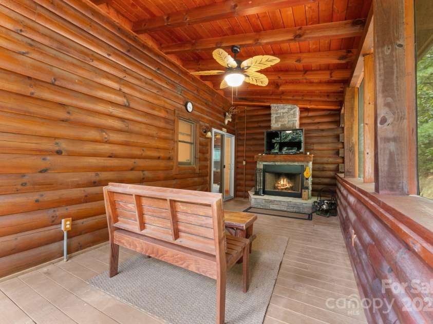 80 Slow Lane, Whittier, NC 28789.  MLS# CAR4307656, YatesRealty ID 5016. Lanai out sliding doors from dining room