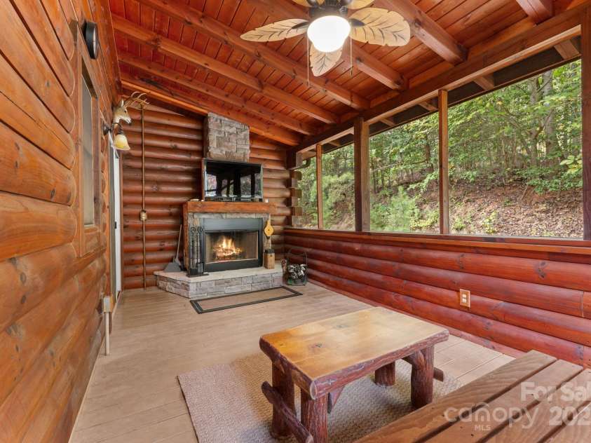 80 Slow Lane, Whittier, NC 28789.  MLS# CAR4307656, YatesRealty ID 5016. Lanai out sliding doors from dining room