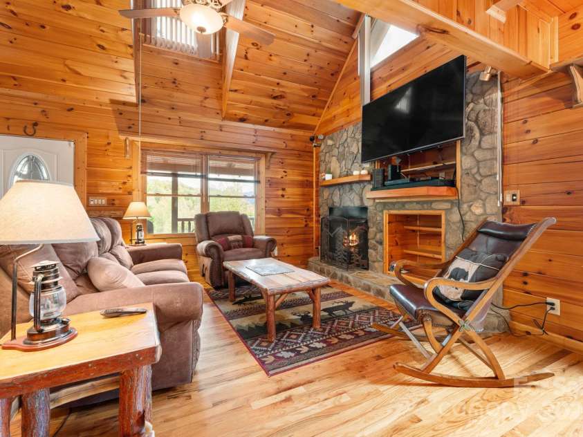 80 Slow Lane, Whittier, NC 28789.  MLS# CAR4307656, YatesRealty ID 5016. Living room (angle from kitchen)