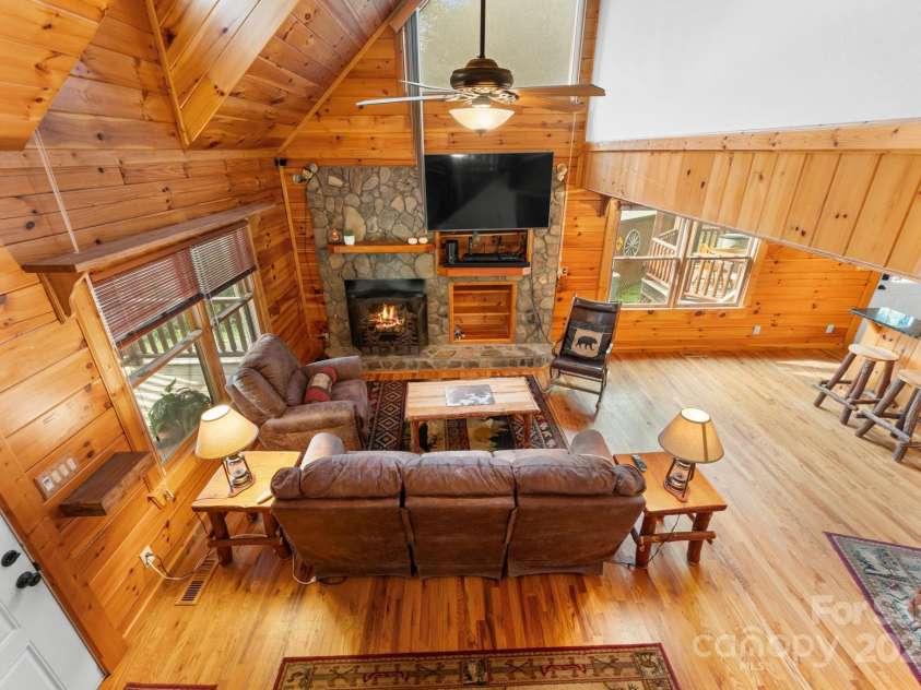 80 Slow Lane, Whittier, NC 28789.  MLS# CAR4307656, YatesRealty ID 5016. Living room from second floor