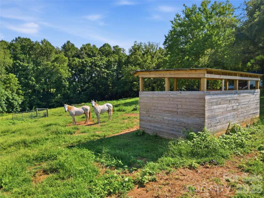 594 Rash Road, Olin, NC 28660.  MLS# CAR4417866, YatesRealty ID 50191. Pasture with run in shed