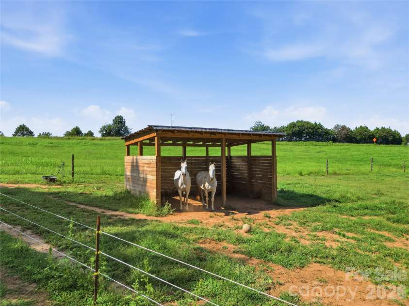 594 Rash Road, Olin, NC 28660.  MLS# CAR4417866, YatesRealty ID 50191. Run in shed