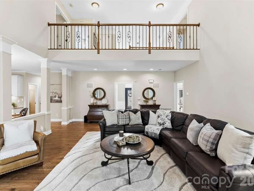 7337 Versailles Lane, Charlotte, NC 28277.  MLS# CAR4418758, YatesRealty ID 50195. The expansive upper-level overlook creates a dramatic connection between the great room and second floor