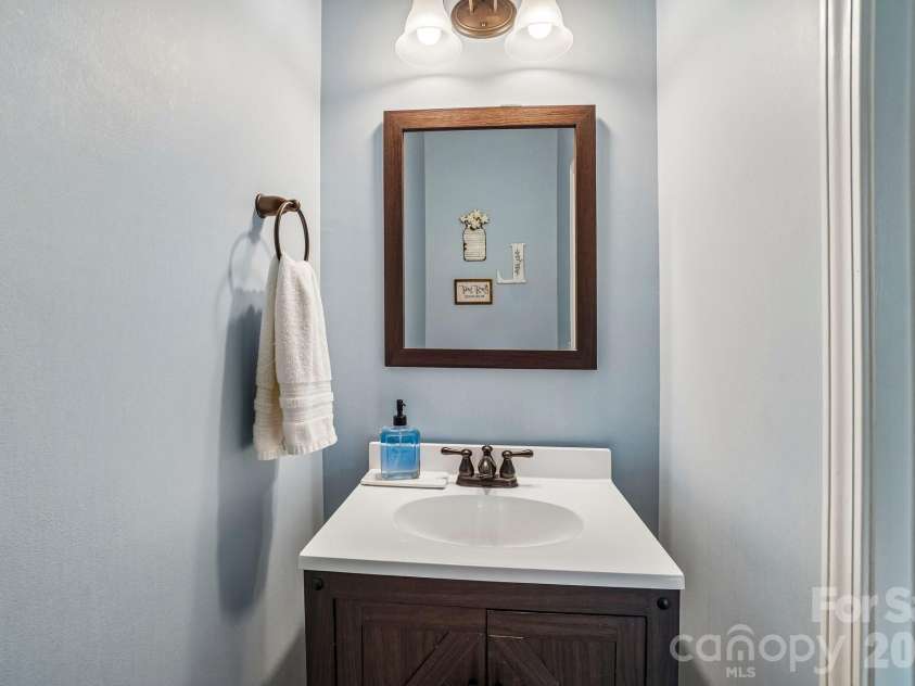 19 Glen Coe Drive, Fletcher, NC 28732.  MLS# CAR4418836, YatesRealty ID 50196. Convenient half bath on main level for guests