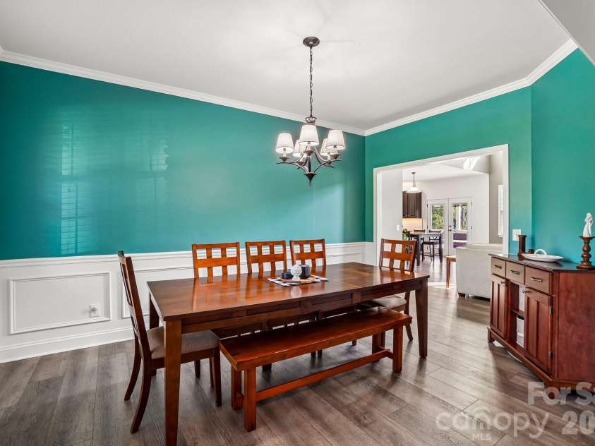 19 Glen Coe Drive, Fletcher, NC 28732.  MLS# CAR4418836, YatesRealty ID 50196. Just steps from the kitchen, this dining room turns everyday dinners into something worth savoring.