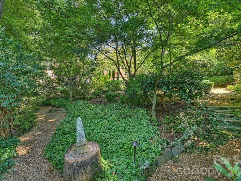 2115 Foxcroft Woods Lane, Charlotte, NC 28211.  MLS# CAR4418029, YatesRealty ID 50200. Winding trails throughout the backyard.