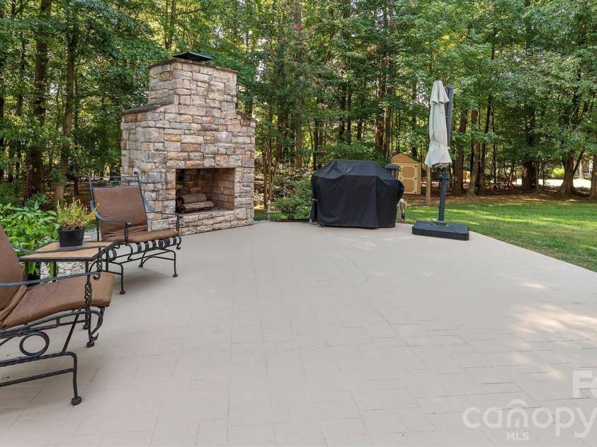 7786 Chapel Creek Drive, Denver, NC 28037.  MLS# CAR4407968, YatesRealty ID 50207. Beautiful patio with fireplace...