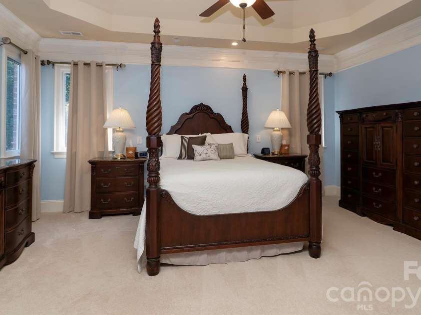 7786 Chapel Creek Drive, Denver, NC 28037.  MLS# CAR4407968, YatesRealty ID 50207. Primary bedroom with tray ceiling...