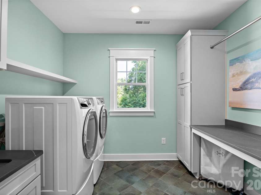 2511 Tower Court, Charlotte, NC 28209.  MLS# CAR4415814, YatesRealty ID 50224. Laundry room with counterspace and storage