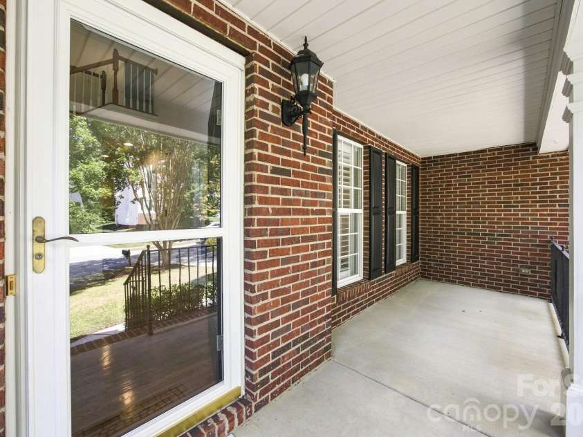 10309 Elven Lane, Charlotte, NC 28269.  MLS# CAR4423186, YatesRealty ID 50243. Front porch