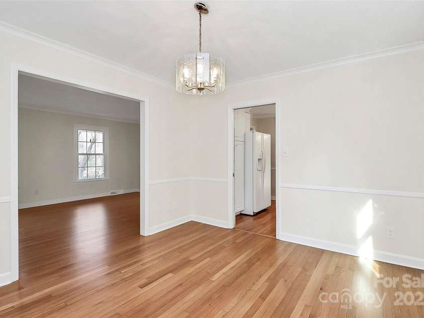 7501 Folger Drive, Charlotte, NC 28226.  MLS# CAR4325075, YatesRealty ID 50246. Dining room connected to kitchen and Living room2
