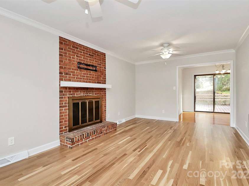 7501 Folger Drive, Charlotte, NC 28226.  MLS# CAR4325075, YatesRealty ID 50246. Family room with fireplace