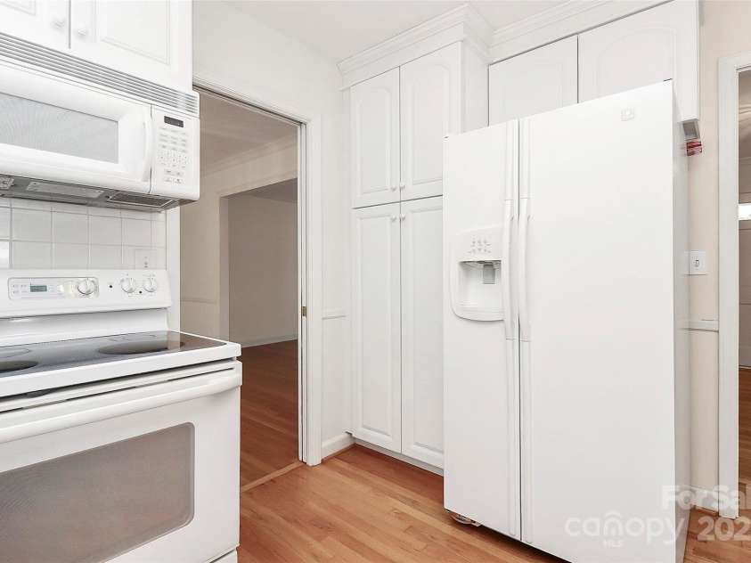 7501 Folger Drive, Charlotte, NC 28226.  MLS# CAR4325075, YatesRealty ID 50246. Kitchen- fridge remains
