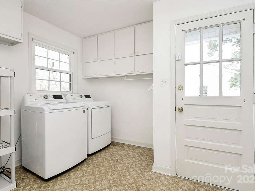 7501 Folger Drive, Charlotte, NC 28226.  MLS# CAR4325075, YatesRealty ID 50246. Spacious laundry and mud room at side entrance- washer and dryer remain