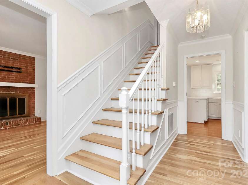 7501 Folger Drive, Charlotte, NC 28226.  MLS# CAR4325075, YatesRealty ID 50246. Stairs near front door to upper level