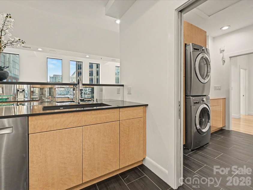 127 Tryon Street, Charlotte, NC 28202.  MLS# CAR4388173, YatesRealty ID 5025. Kitchen looking into Laundry