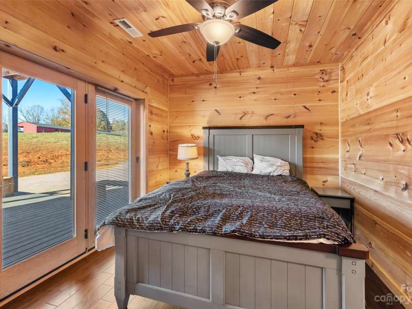 1642 Smith Waldrop Road, Mill Spring, NC 28756.  MLS# CAR4089037, YatesRealty ID 5025. Lower Level Jack Jill Bedroom with view of Arena