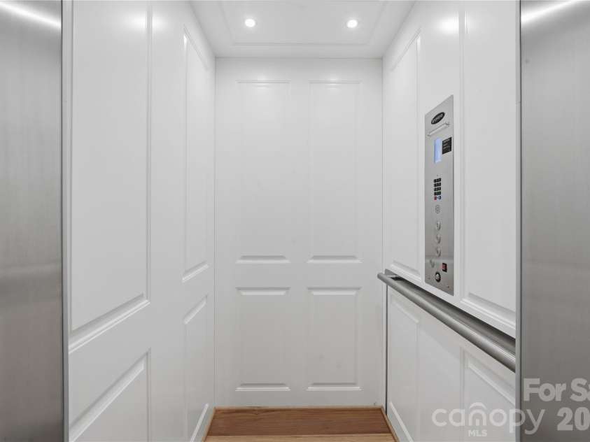 6239 Sharon Hills Road, Charlotte, NC 28210.  MLS# CAR4423022, YatesRealty ID 50254. Savaria Elevator w/ hickory floors