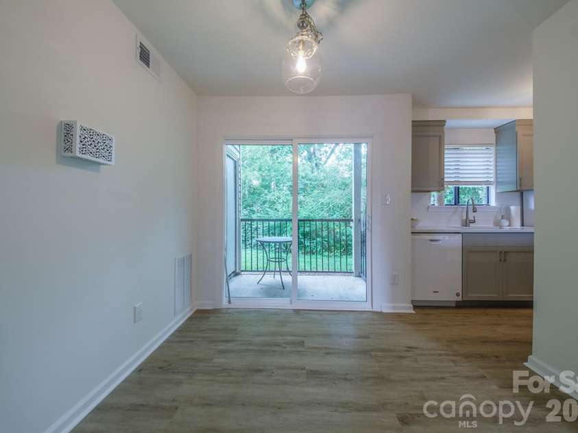 11022 Running Ridge Road, Charlotte, NC 28226.  MLS# CAR4422317, YatesRealty ID 50264. Dining Kitchen and Back Patio