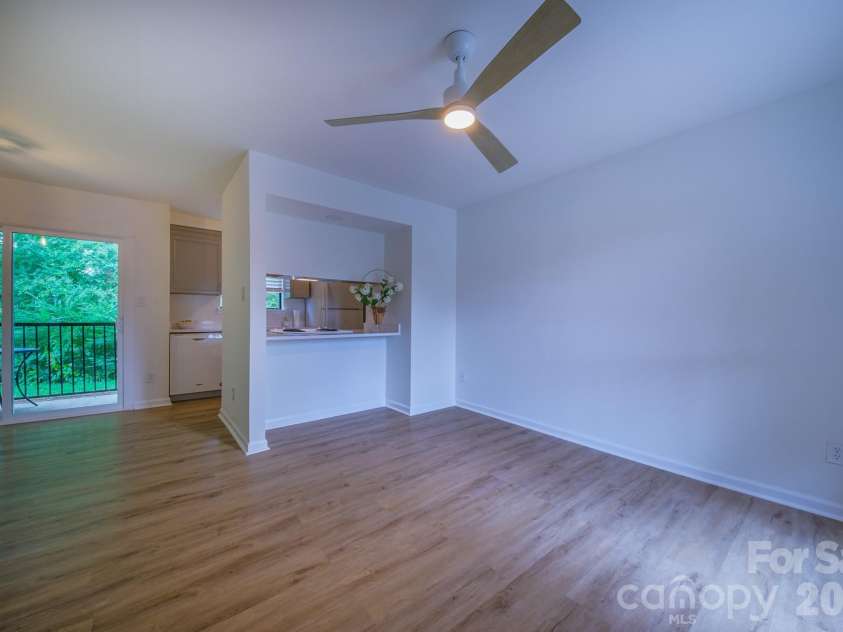 11022 Running Ridge Road, Charlotte, NC 28226.  MLS# CAR4422317, YatesRealty ID 50264. Living Room, Dining and kitchen