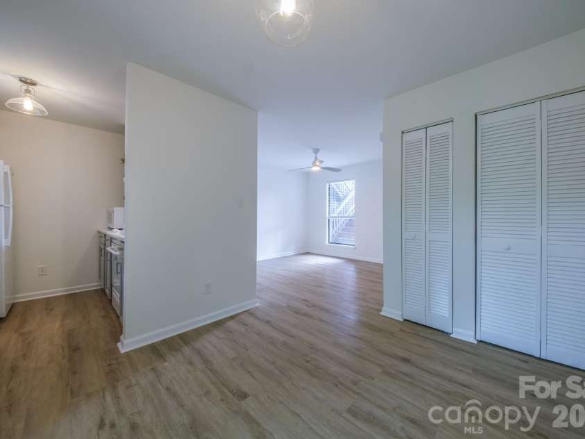 11022 Running Ridge Road, Charlotte, NC 28226.  MLS# CAR4422317, YatesRealty ID 50264. Living Room, Dining and kitchen