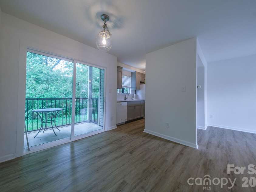 11022 Running Ridge Road, Charlotte, NC 28226.  MLS# CAR4422317, YatesRealty ID 50264. Living Room, Dining and kitchen