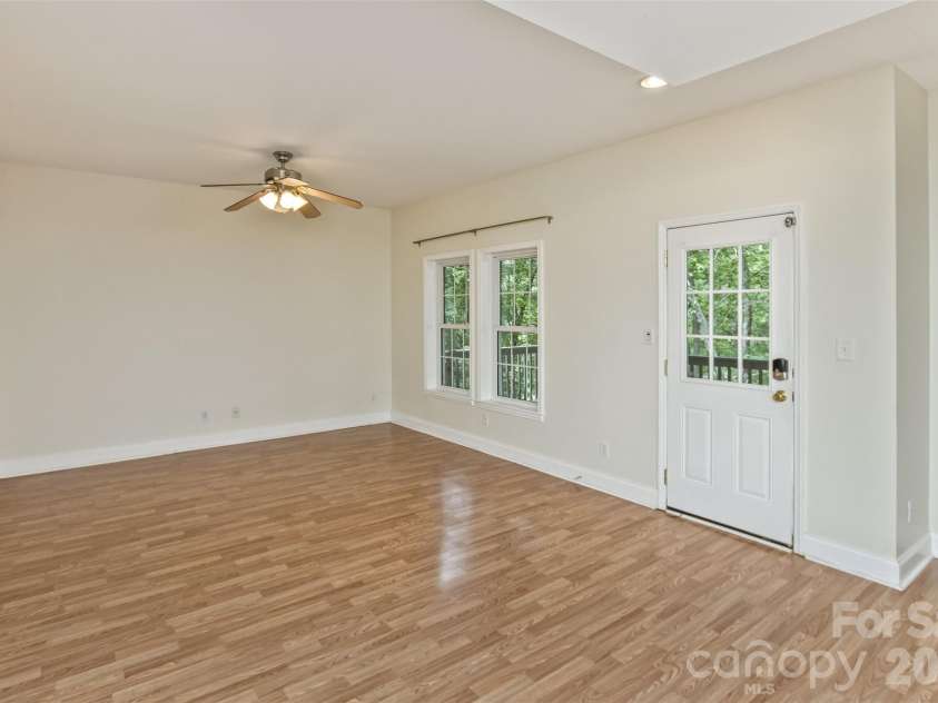 113 Ballantree Drive, Asheville, NC 28803.  MLS# CAR4417051, YatesRealty ID 50269. Finished Basement is one big open space that can be separated into different area- this is the area to the left