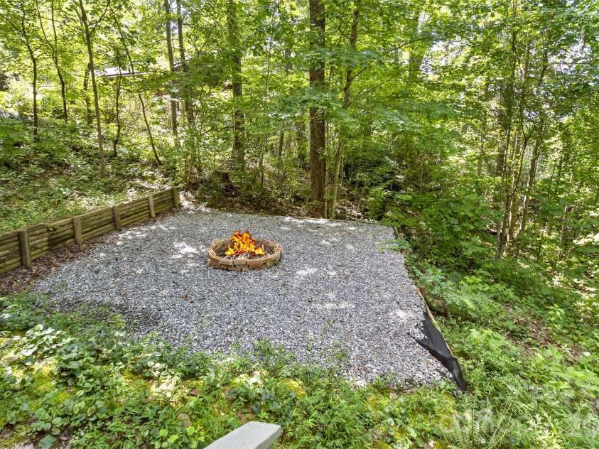 113 Ballantree Drive, Asheville, NC 28803.  MLS# CAR4417051, YatesRealty ID 50269. Fire Pit off the basement deck