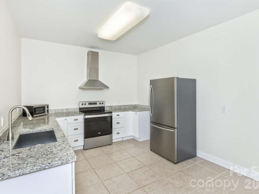 113 Ballantree Drive, Asheville, NC 28803.  MLS# CAR4417051, YatesRealty ID 50269. Full Kitchen in the basement