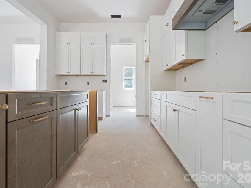 6395 Wingate Hill Road, Denver, NC 28037.  MLS# CAR4423290, YatesRealty ID 50281. The two toned cabinetry has pretty hardware and soft close hinges.